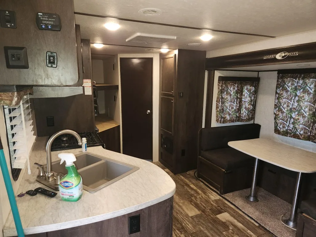 Mossy Oak Cabin bathroom sink and mirror