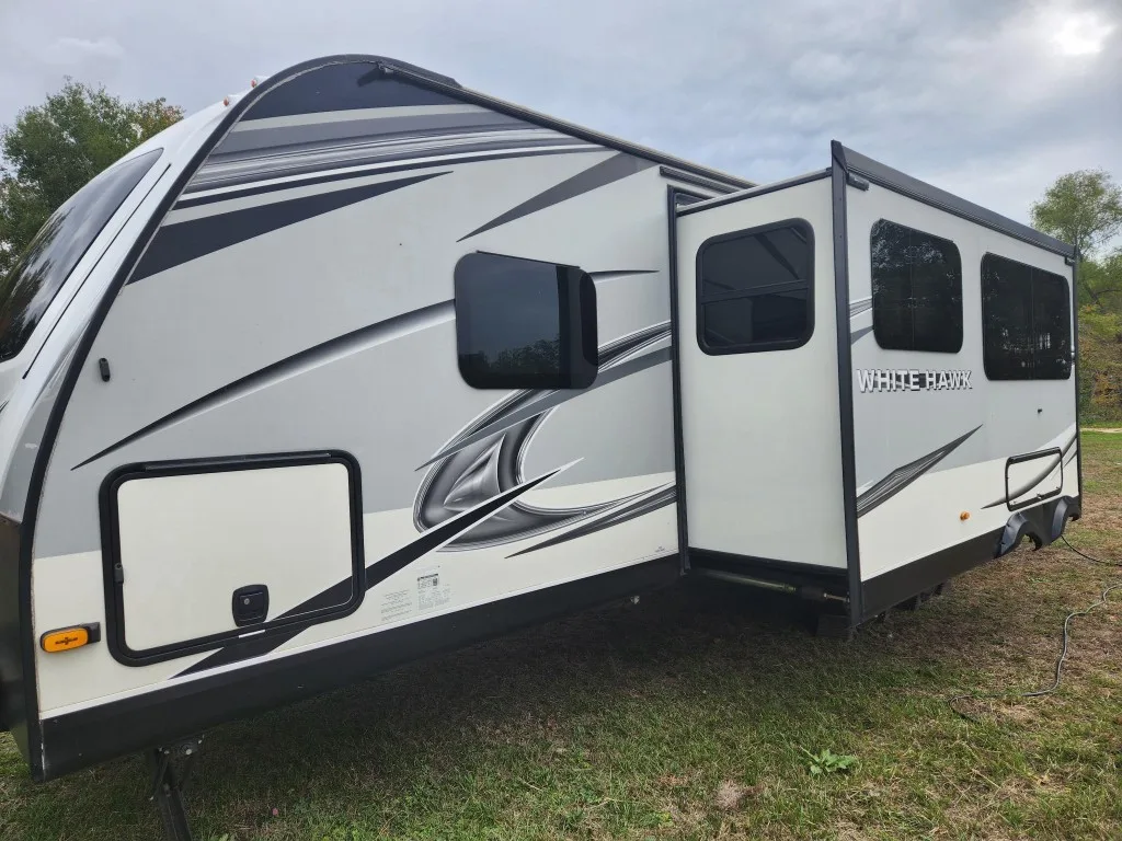 White Hawk RV side exterior with slide out