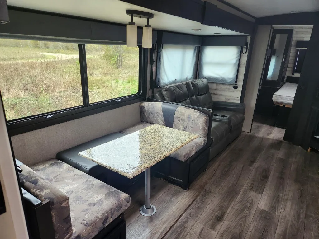 White Hawk RV dinette and recliner seating area